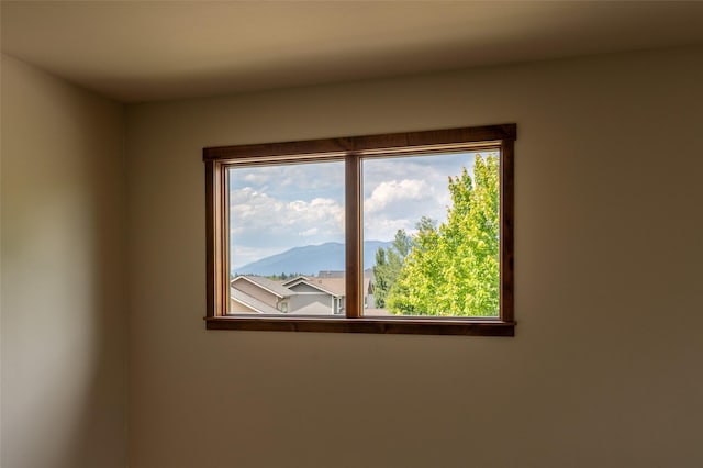 6008 St Moritz Dr Unit K, Whitefish, MT 59937 - unfurnished room featuring a mountain view and healthy amount of natural light
