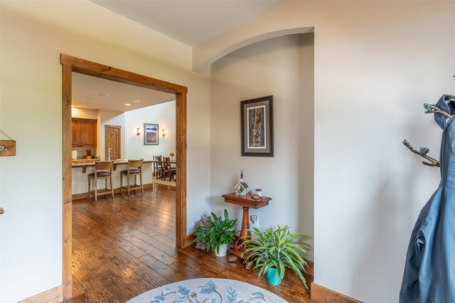 6008 St Moritz Dr Unit K, Whitefish, MT 59937 - hallway with dark wood-style flooring and arched walkways