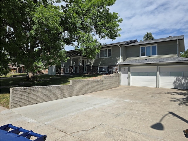 761 32nd Ave NE, Great Falls, MT 59404 - view of front of home featuring concrete driveway and a garage