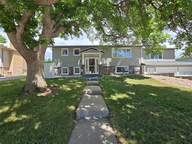 761 32nd Ave NE, Great Falls, MT 59404 - raised ranch featuring a front yard and stone siding