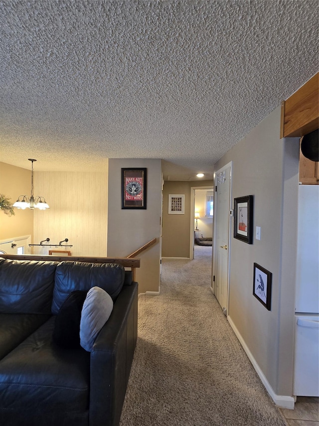 761 32nd Ave NE, Great Falls, MT 59404 - living room with a textured ceiling, a chandelier, and light carpet