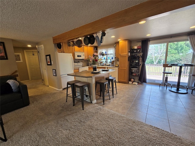 761 32nd Ave NE, Great Falls, MT 59404 - kitchen with white appliances, a textured ceiling, plenty of natural light, recessed lighting, and open shelves