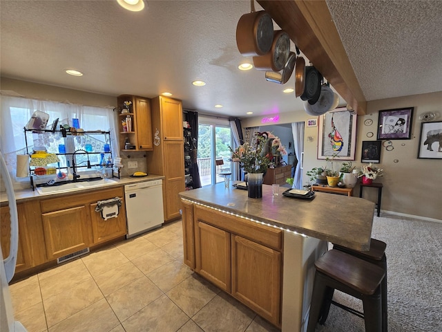 761 32nd Ave NE, Great Falls, MT 59404 - kitchen with dishwasher, a textured ceiling, brown cabinets, recessed lighting, and open shelves