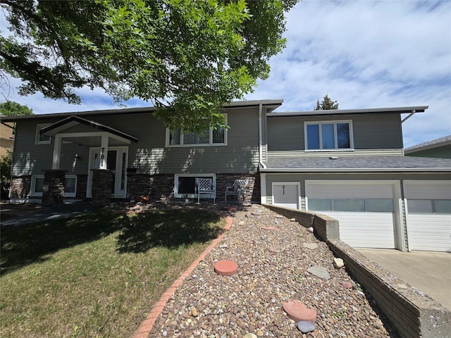 761 32nd Ave NE, Great Falls, MT 59404 - view of front facade featuring an attached garage, a front lawn, and driveway