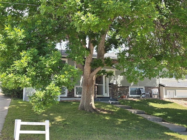 761 32nd Ave NE, Great Falls, MT 59404 - obstructed view of property featuring stone siding
