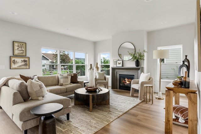 5465 Remington Dr, Missoula, MT 59808 - living room featuring light wood finished floors, a glass covered fireplace, and recessed lighting