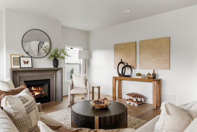 5465 Remington Dr, Missoula, MT 59808 - living area with a lit fireplace, wood finished floors, and recessed lighting