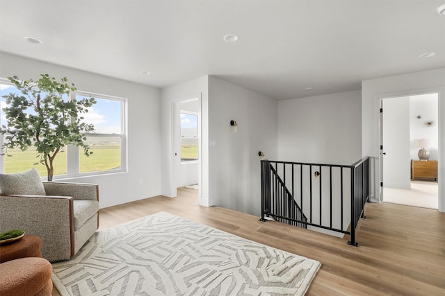 5465 Remington Dr, Missoula, MT 59808 - sitting room featuring an upstairs landing, light wood-style floors, and recessed lighting