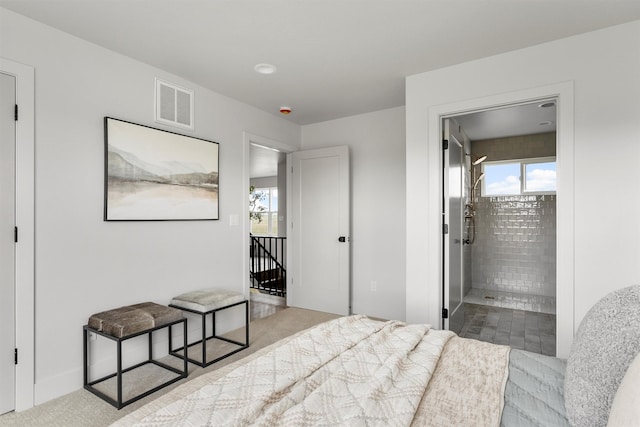 5465 Remington Dr, Missoula, MT 59808 - bedroom with multiple windows, connected bathroom, and carpet flooring