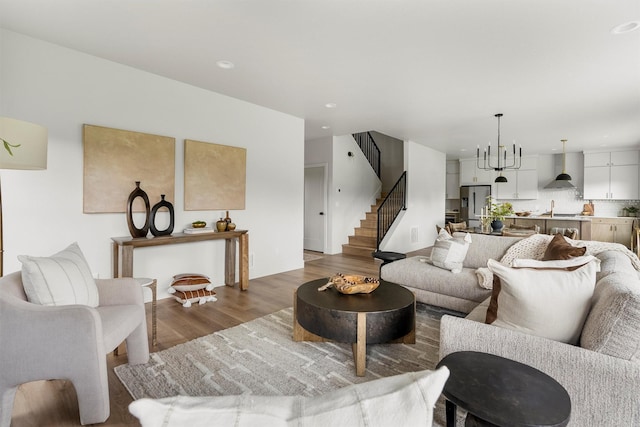 5465 Remington Dr, Missoula, MT 59808 - living room with wood finished floors, stairway, and recessed lighting