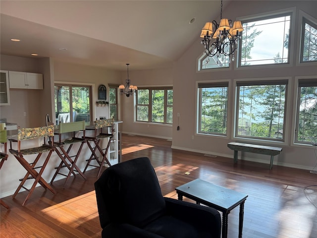 151 Whisper Ridge Dr, Bigfork, MT 59911 - living area with a chandelier, wood finished floors, recessed lighting, and high vaulted ceiling