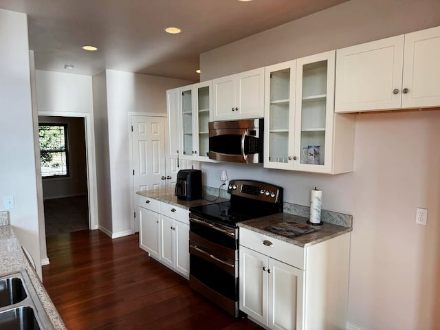151 Whisper Ridge Dr, Bigfork, MT 59911 - kitchen featuring appliances with stainless steel finishes, dark wood finished floors, white cabinetry, and recessed lighting
