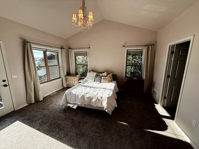 151 Whisper Ridge Dr, Bigfork, MT 59911 - bedroom with a chandelier, lofted ceiling, and carpet floors