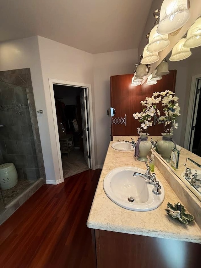 151 Whisper Ridge Dr, Bigfork, MT 59911 - full bath with wood finished floors, double vanity, and a stall shower