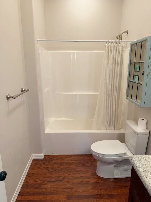 151 Whisper Ridge Dr, Bigfork, MT 59911 - full bath with vanity, shower / bathtub combination with curtain, and wood finished floors