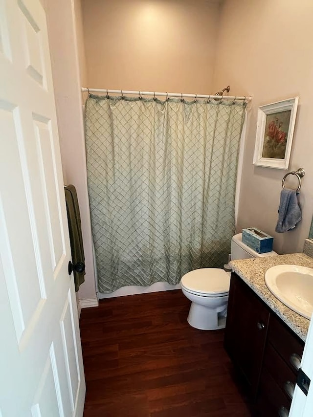 151 Whisper Ridge Dr, Bigfork, MT 59911 - full bathroom with wood finished floors, vanity, and shower / bath combo with shower curtain
