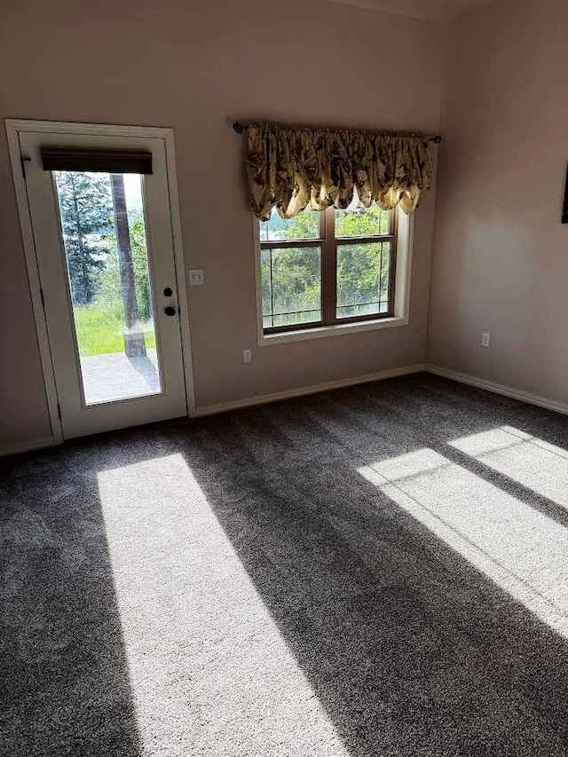 151 Whisper Ridge Dr, Bigfork, MT 59911 - unfurnished dining area featuring plenty of natural light and carpet