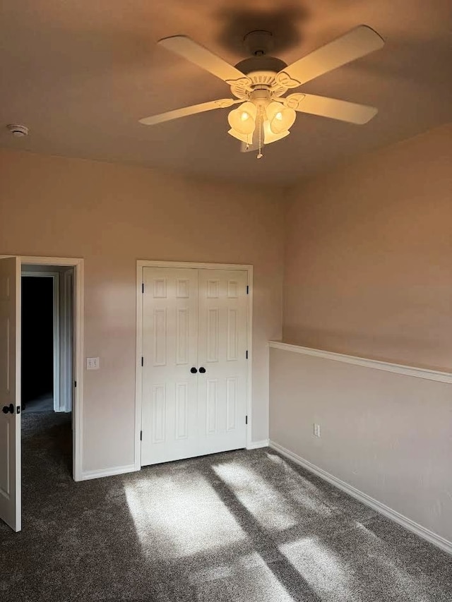 151 Whisper Ridge Dr, Bigfork, MT 59911 - unfurnished bedroom featuring carpet floors, ceiling fan, and a closet