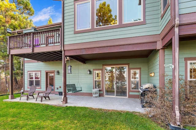 151 Whisper Ridge Dr, Bigfork, MT 59911 - rear view of property with a patio area and a lawn
