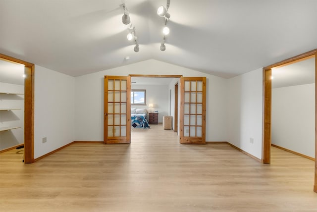 674 Porter Hill Rd, Stevensville, MT 59870 - bonus room with french doors, light wood-type flooring, and lofted ceiling