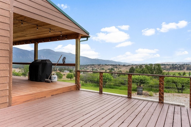 674 Porter Hill Rd, Stevensville, MT 59870 - wooden deck with a mountain view and area for grilling