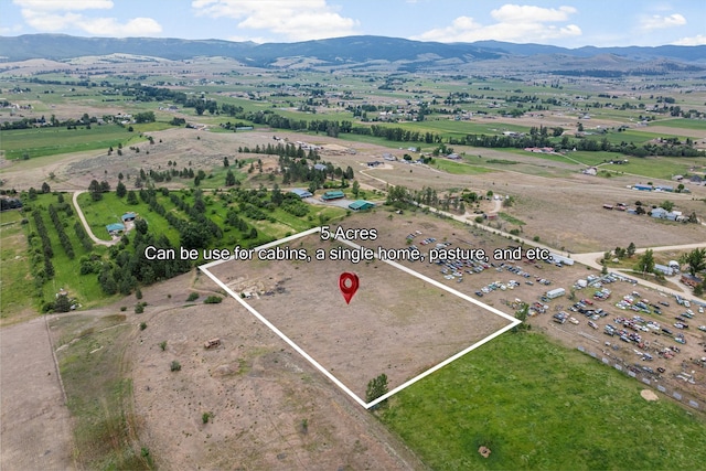 674 Porter Hill Rd, Stevensville, MT 59870 - aerial view of property's location featuring property parcel outlined, rural landscape, and a mountainous background