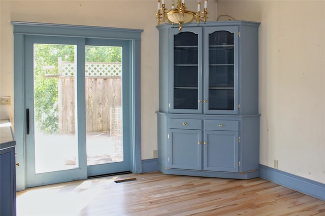 11740 Gopher Dr, Missoula, MT 59808 - doorway with a chandelier and light wood-type flooring
