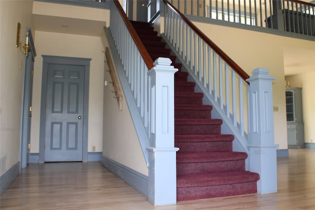 11740 Gopher Dr, Missoula, MT 59808 - stairway with wood finished floors and a towering ceiling