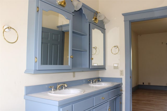 11740 Gopher Dr, Missoula, MT 59808 - full bathroom featuring double vanity and wood finished floors