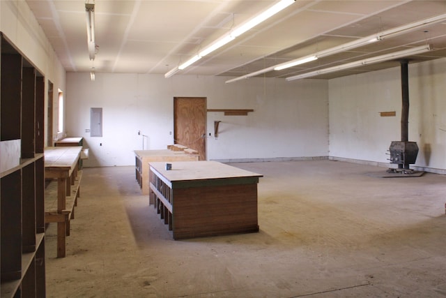 11740 Gopher Dr, Missoula, MT 59808 - garage featuring a wood stove and electric panel