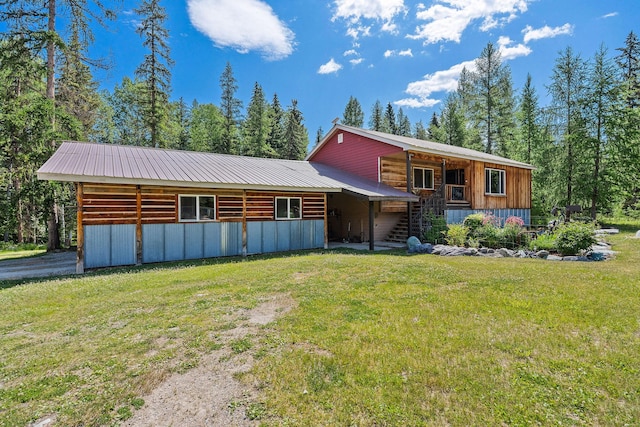 670 Potter Creek Rd, Olney, MT 59927 - view of front of house featuring a front yard, a metal roof, and stairs