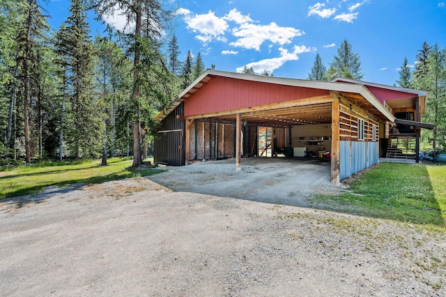 670 Potter Creek Rd, Olney, MT 59927 - garage with a carport and driveway