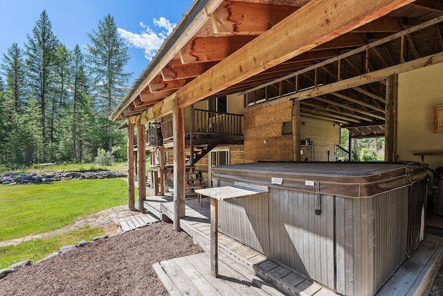 670 Potter Creek Rd, Olney, MT 59927 - deck featuring a hot tub, a lawn, and stairs