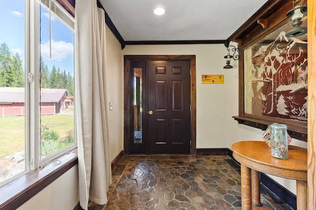 670 Potter Creek Rd, Olney, MT 59927 - foyer entrance with dark stone finish flooring and crown molding