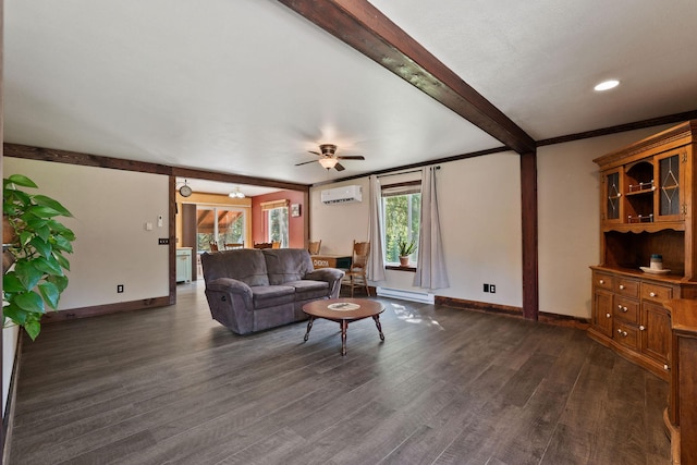 670 Potter Creek Rd, Olney, MT 59927 - living room featuring a wall unit AC, beamed ceiling, dark wood finished floors, and a ceiling fan