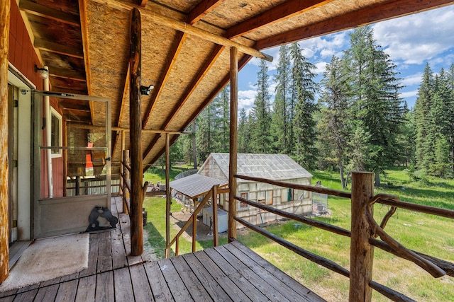 670 Potter Creek Rd, Olney, MT 59927 - wooden terrace with an outdoor structure and a yard