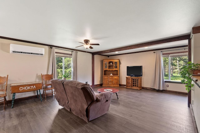 670 Potter Creek Rd, Olney, MT 59927 - living room featuring an AC wall unit, a ceiling fan, dark wood-style floors, beam ceiling, and plenty of natural light