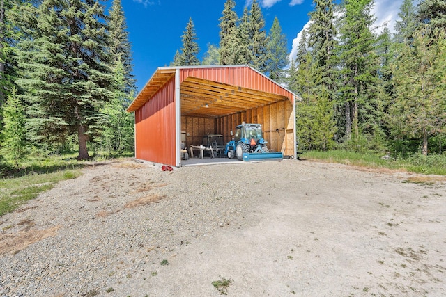 670 Potter Creek Rd, Olney, MT 59927 - view of pole building with a detached carport and a forest view