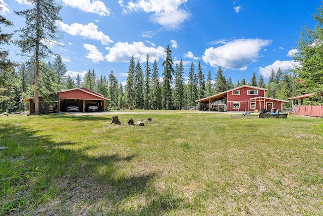 670 Potter Creek Rd, Olney, MT 59927 - view of grassy yard featuring a pole building