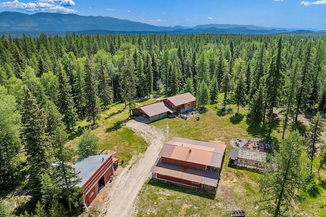 670 Potter Creek Rd, Olney, MT 59927 - view of subject property with a heavily wooded area and a mountainous background