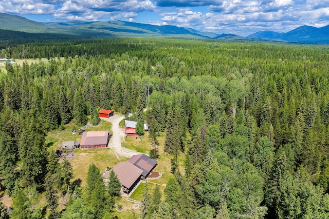 670 Potter Creek Rd, Olney, MT 59927 - aerial view of a forest and a mountainous background