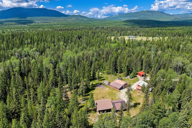 670 Potter Creek Rd, Olney, MT 59927 - drone / aerial view of a forest and mountains