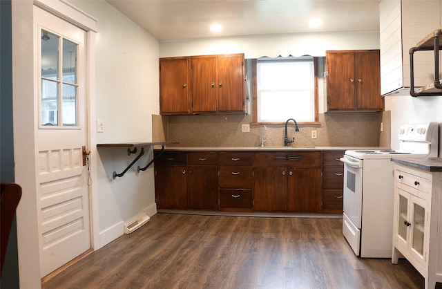 319 2nd St SW, Choteau, MT 59422 - kitchen featuring white electric stove, backsplash, dark wood finished floors, recessed lighting, and light countertops