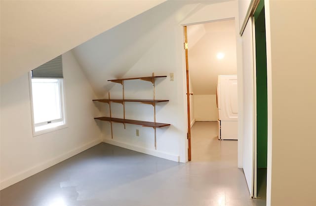 319 2nd St SW, Choteau, MT 59422 - additional living space featuring washer / dryer, vaulted ceiling, and concrete floors