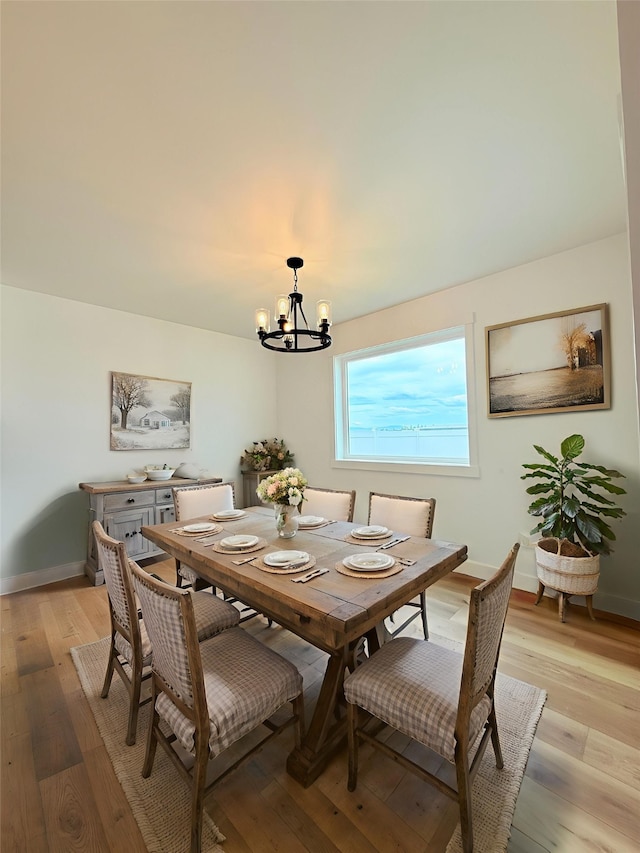 417 I St, Townsend, MT 59644 - dining room featuring a chandelier and light wood-style flooring