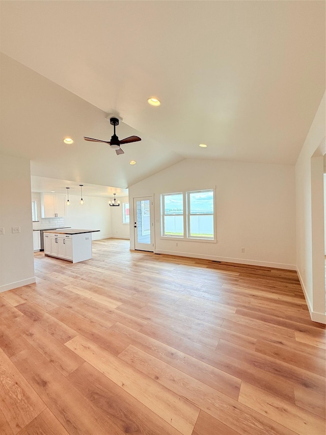 417 I St, Townsend, MT 59644 - unfurnished living room featuring vaulted ceiling, light wood-type flooring, recessed lighting, and a ceiling fan