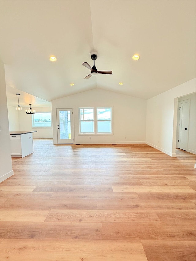 417 I St, Townsend, MT 59644 - unfurnished living room with a ceiling fan, light wood-style flooring, vaulted ceiling, and recessed lighting