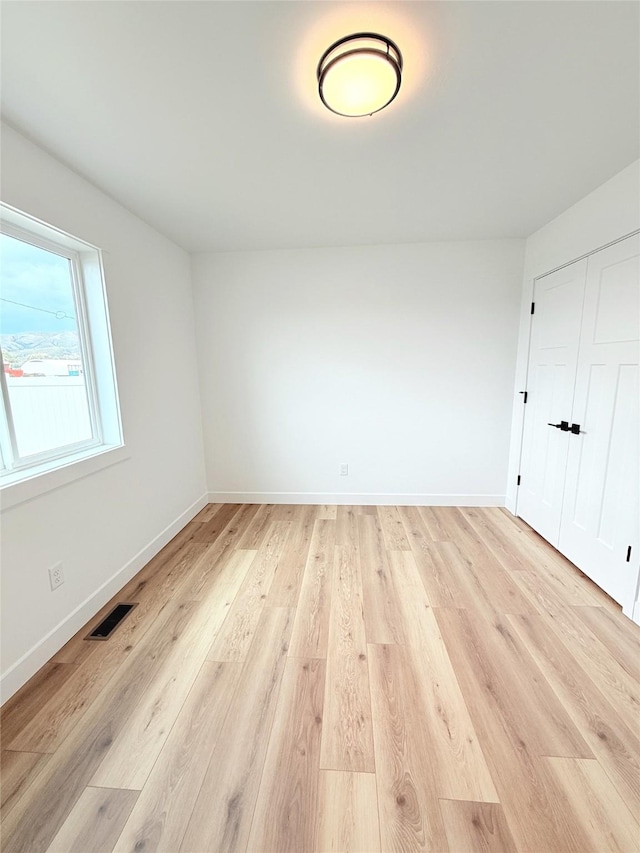 417 I St, Townsend, MT 59644 - unfurnished bedroom featuring light wood finished floors and a closet