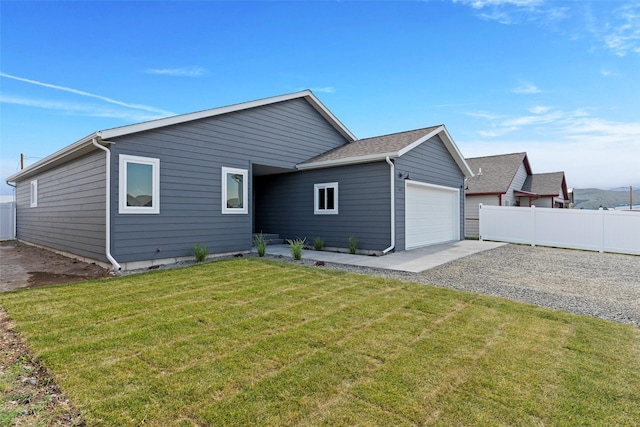 417 I St, Townsend, MT 59644 - back of house with an attached garage and driveway