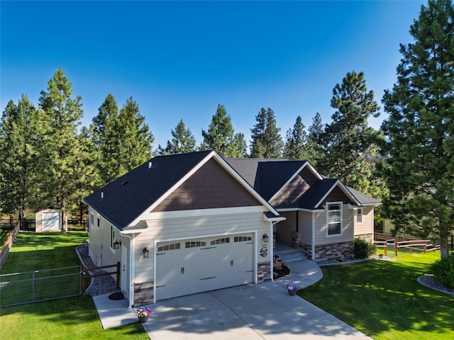 10487 Coulter Pine St, Lolo, MT 59847 - craftsman-style house featuring stone siding, driveway, a garage, and a storage unit